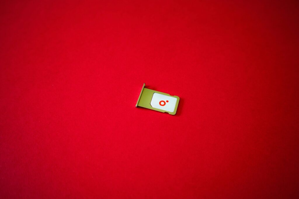 A SIM card tray removed from a phone