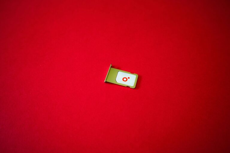 A SIM card tray removed from a phone