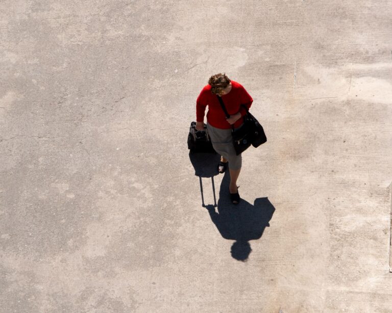 Top-down shot of a traveler with luggage, relevant to updating your passport after a legal name change
