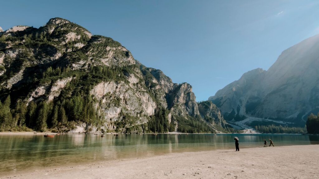 Shore of Lago di Braies in the Dolomites, where car access is restricted in summer