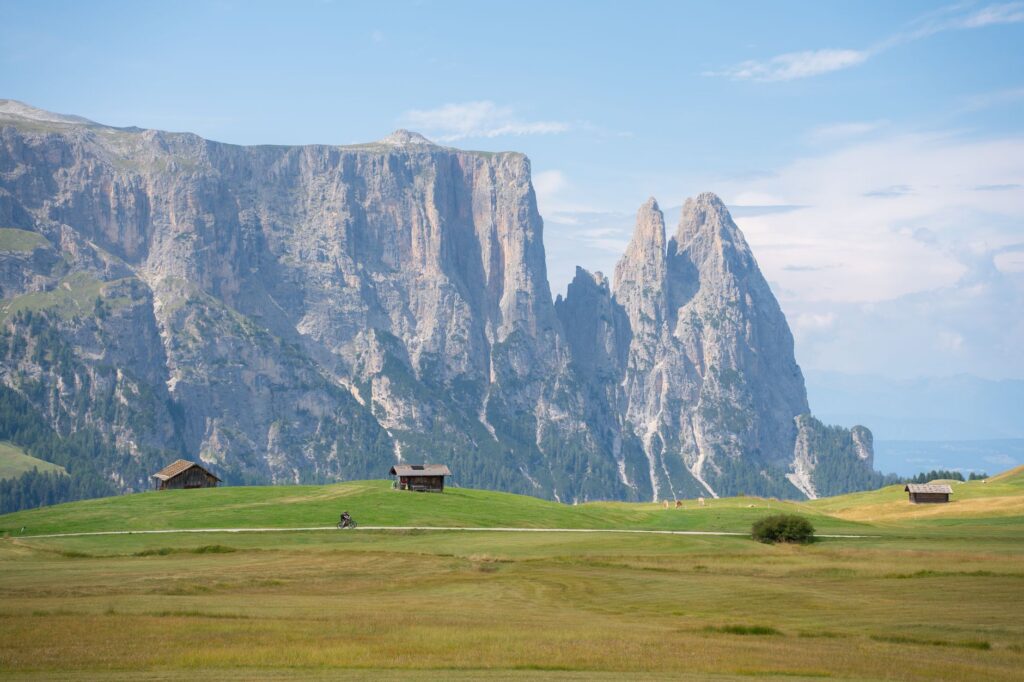 Alpe di Siusi meadows and huts below the Sciliar, day two of a Dolomites itinerary