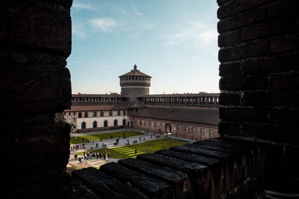 Courtyard of the Castello Sforzesco seen through the battlements, day two of a Milan itinerary