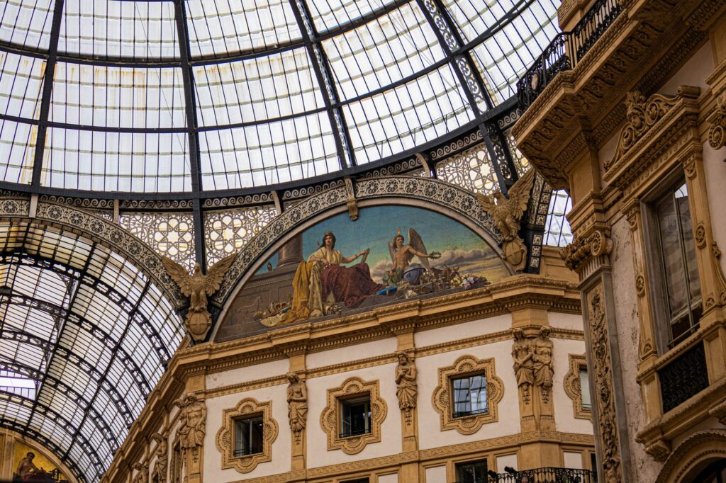Glass dome and painted lunette of the Galleria Vittorio Emanuele II, day one of a Milan itinerary