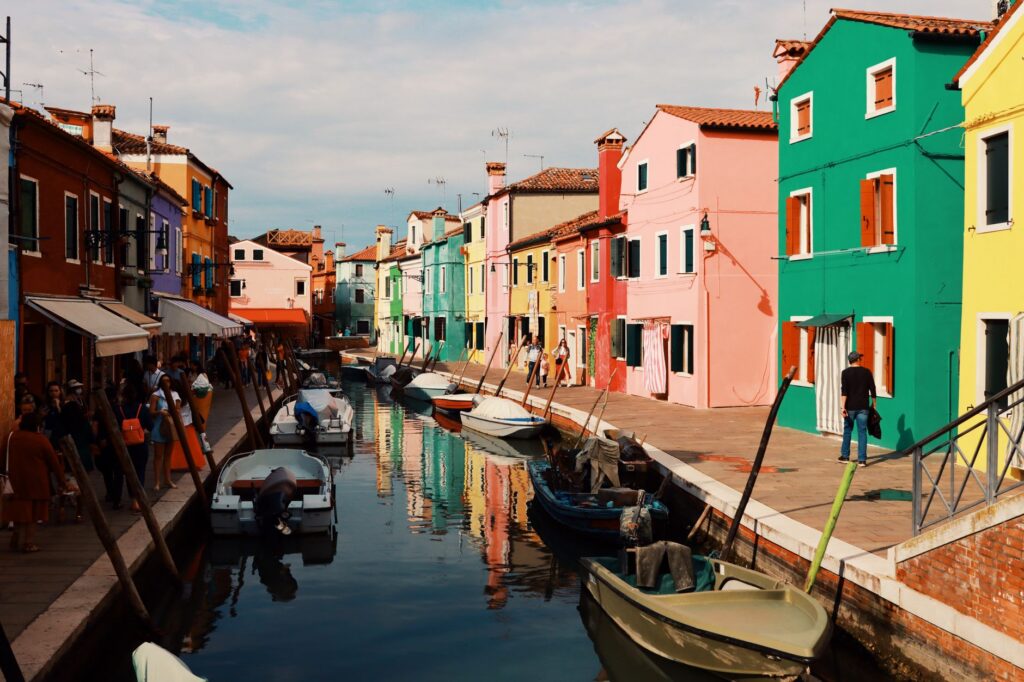 Painted houses along a canal on Burano, a day trip from Venice by vaporetto